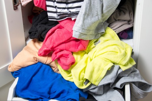 Operative using protective equipment while handling commercial waste